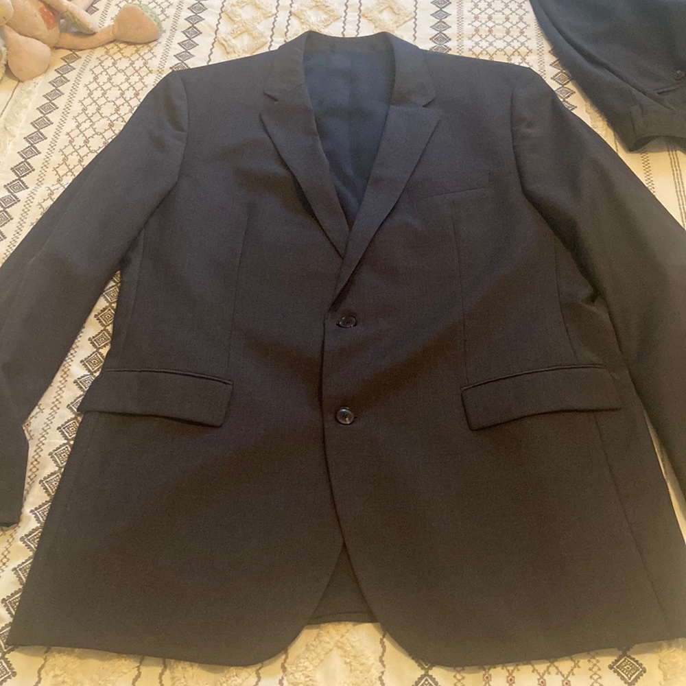 Hugo Boss suit gently used. Pants 44.5 in long